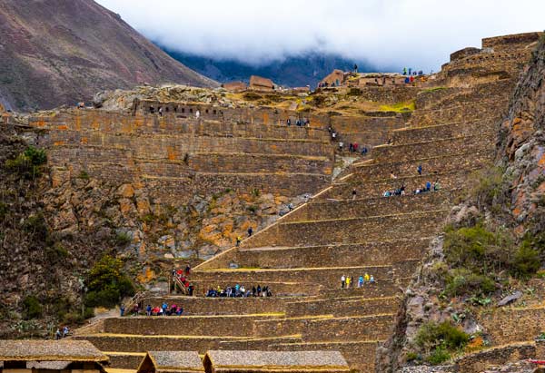 Ollantaytambo in Peru showing ancient Inca terraces, stone fortress ruins, and traditional Andean town in the Sacred Valley