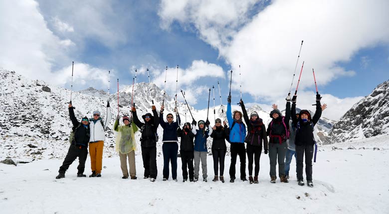 Hikers on the Salkantay Trekking in Peru with snow-capped mountains in the background, Discover the Salkantay